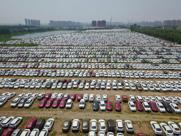 New cars are seen in a parking lot of the Brilliance factory in Shenyang, in China’s northeast Liaoning province, on Monday  (AFP photo)